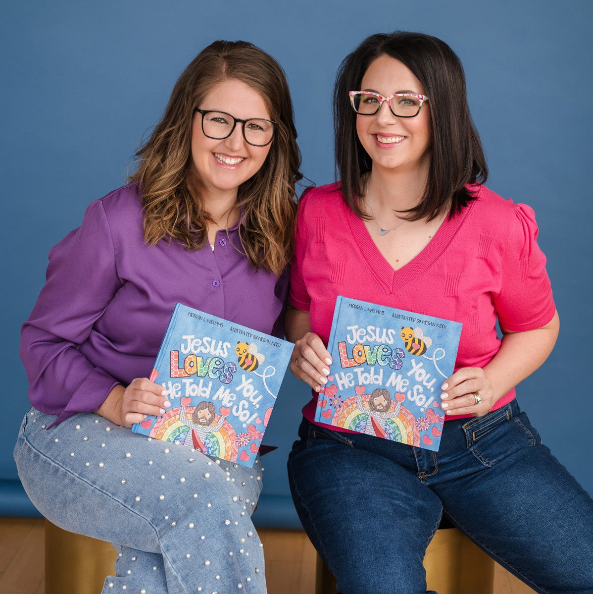 Bee Like Jesus Books author Morgan Williams and illustrator Megan Koch smiling and holding copies of their children’s book, Jesus Loves You, He Told Me So!